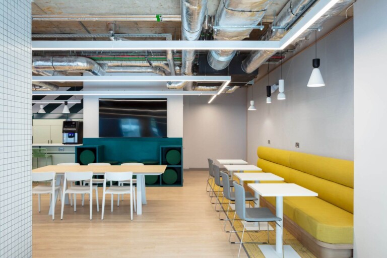 A shared space at Coleman Court. There are chairs and tables. It looks a little like a dining hall.