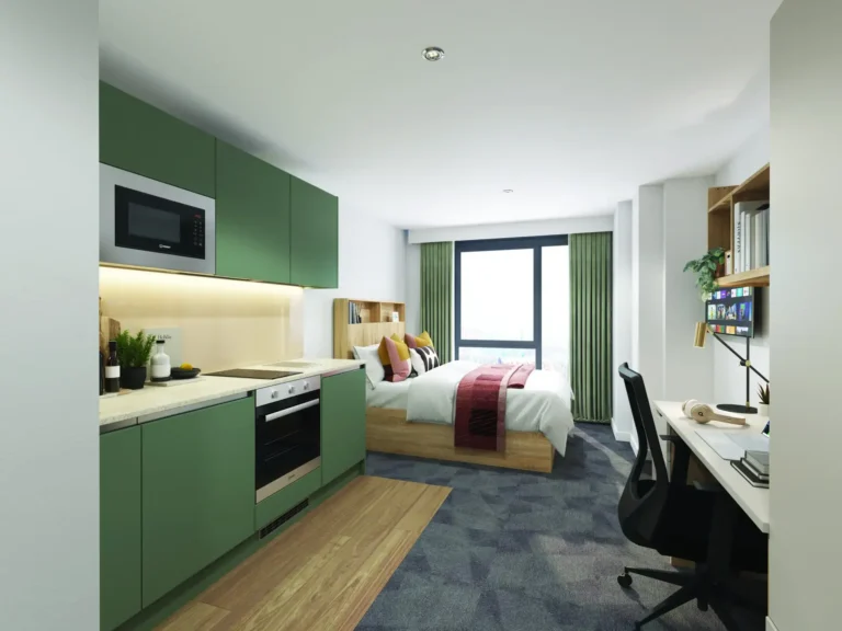A student apartment room. It is light and spacious, but seems to pack a lot in, with a good sized bed, a desk, a large wall mounted TV and kitchen facilities